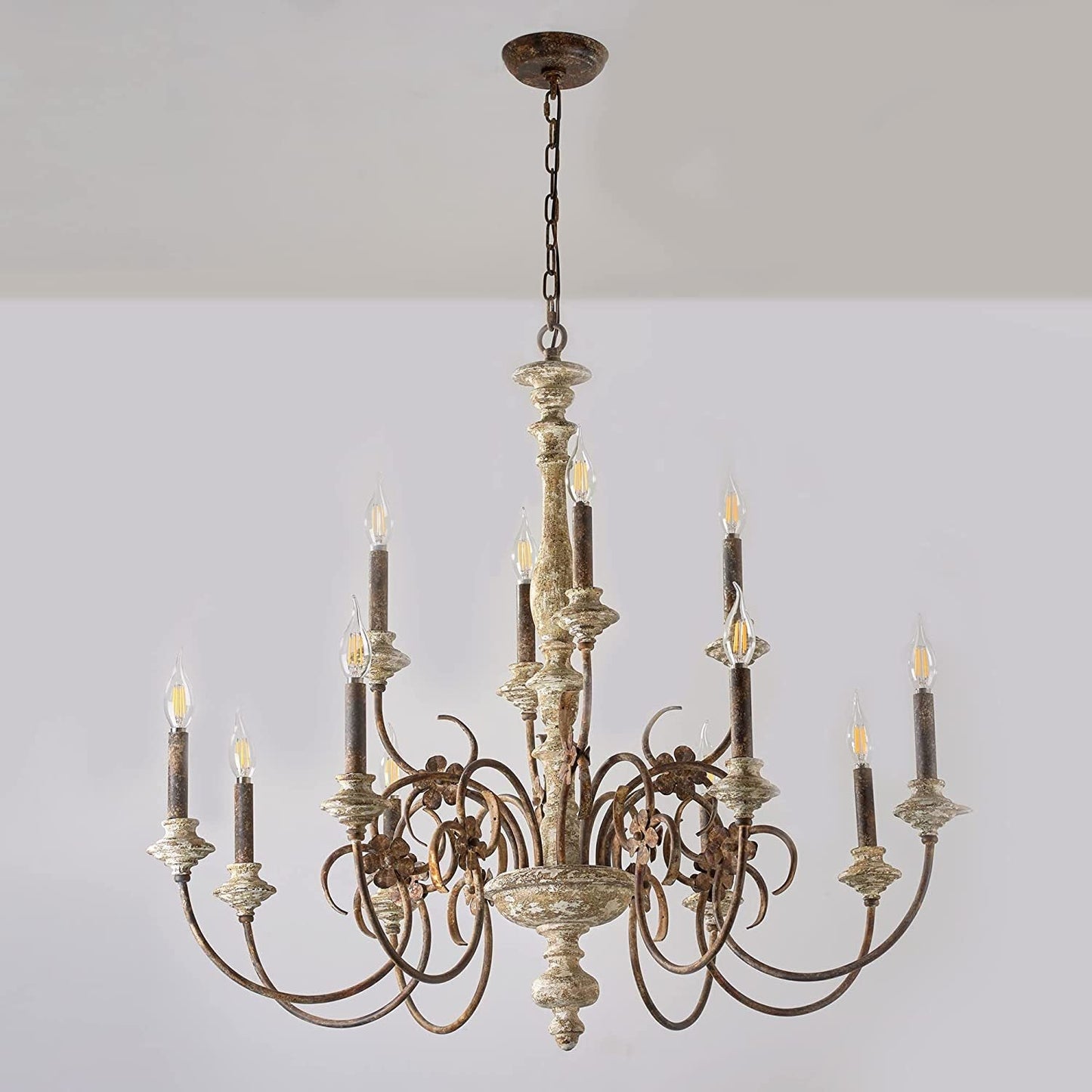 Decorative chandelier with multiple candles against a plain background