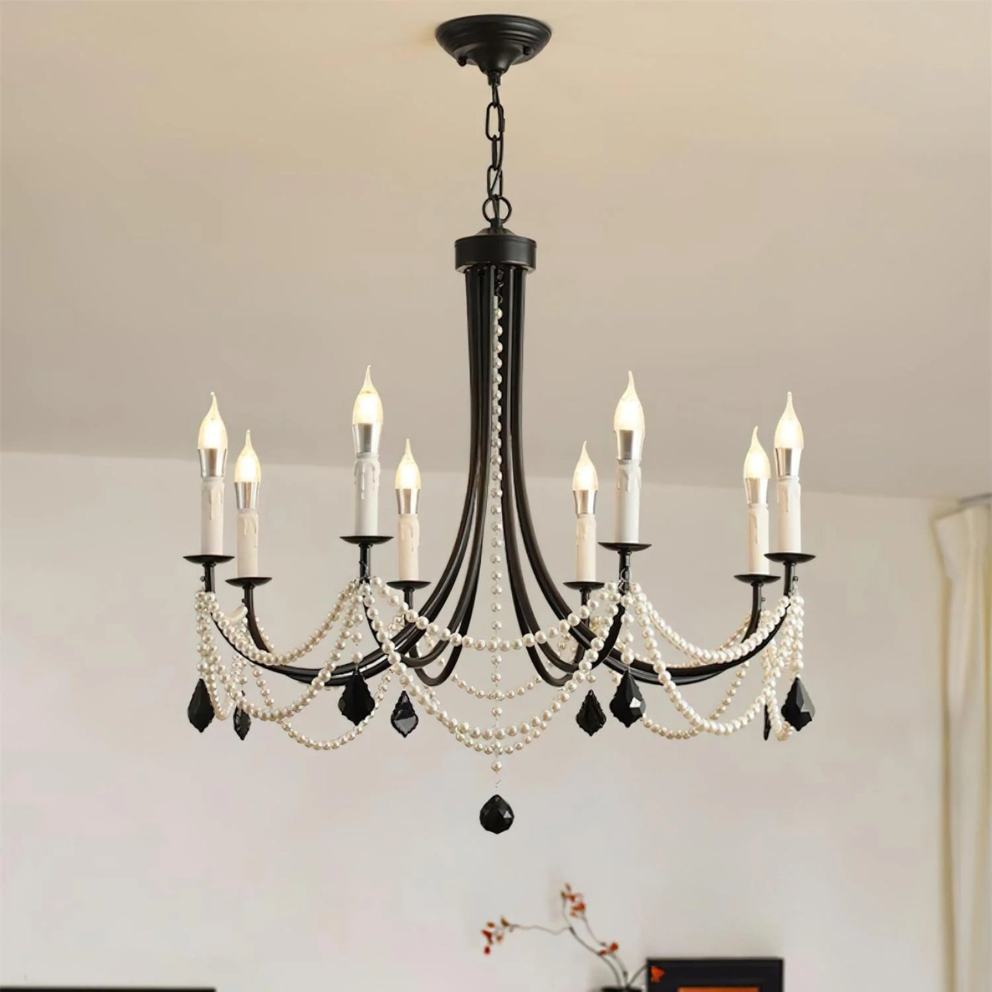 Decorative chandelier with candles in a room setting